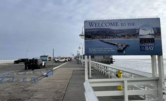 A closed wharf is seen in Santa Cruz, Calif., Monday, Dec. 23, 2024, after the pier partially collapsed and fell into the ocean. (AP Photo/Martha Mendoza)