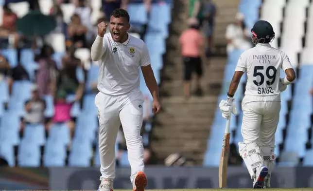 South Africa's Dane Paterson, left, celebrates after taking a wicket of Pakistan's Aamer Jamal during day three of the Test cricket match between South Africa and Pakistan, at the Centurion Park in Centurion, South Africa, Saturday, Dec. 28, 2024. (AP Photo/Themba Hadebe)