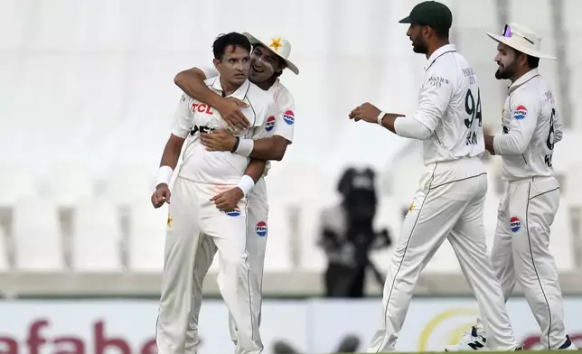 Pakistan's Mohammad Abbas, left, celebrates with teammates after successfully appealing for LBW against South Africa's Tristan Stubbs during day three of the Test cricket match between South Africa and Pakistan, at the Centurion Park in Centurion, South Africa, Saturday, Dec. 28, 2024. (AP Photo/Themba Hadebe)