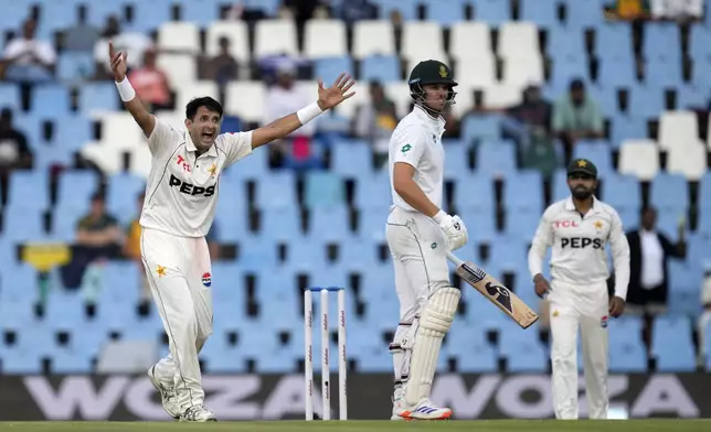 Pakistan's Mohammad Abbas, left, successfully appeals for LBW against South Africa's Tristan Stubbs during day three of the Test cricket match between South Africa and Pakistan, at the Centurion Park in Centurion, South Africa, Saturday, Dec. 28, 2024. (AP Photo/Themba Hadebe)