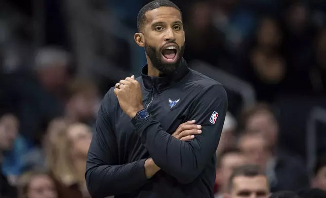 Charlotte Hornets head coach Charles Lee looks on during the first half of an NBA basketball game against the Chicago Bulls in Charlotte, N.C., Monday, Dec. 30, 2024. (AP Photo/Jacob Kupferman)