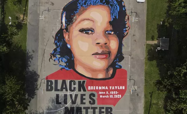 FILE - A ground mural depicting a portrait of Breonna Taylor is seen at Chambers Park in Annapolis, Md., July 6, 2020. (AP Photo/Julio Cortez, File)