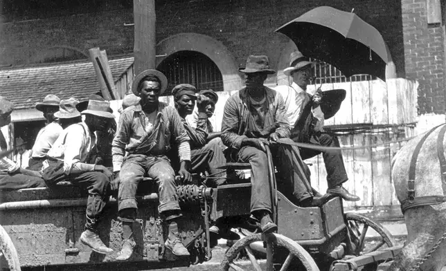 This undated photo shows convicts on a horse-drawn wagon in Birmingham, Ala. (Birmingham, Ala., Public Library Archives via AP)