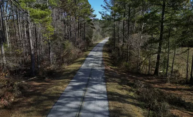 A section of Elder Road stretches past the spot, Saturday, Dec. 7, 2024, where an Alexander City Community Work Center transport van crashed in April, killing Willie Crayton and Bruce Clements, in Dadeville, Ala. (AP Photo/Carolyn Kaster)