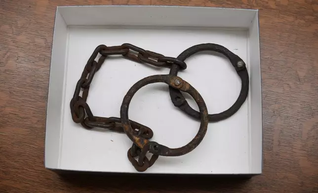 Shackles used during the time of convict leasing lay stored in a box at the Birmingham Public Libray Central Branch Archives, Friday, Dec. 6, 2024, in Birmingham, Ala. (AP Photo/Carolyn Kaster)