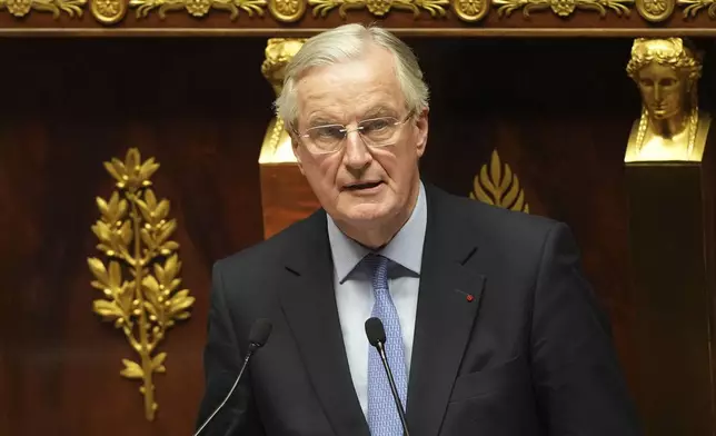 French Prime Minister Michel Barnier addresses the National Assembly prior to a vote on a no-confidence motion that could bring him down and his cabinet for the first time since 1962, Wednesday, Dec. 4, 2024 in Paris. (AP Photo/Michel Euler)