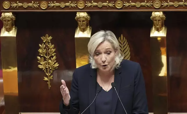 French far-right leader Marine Le Pen delivers her speech at the National Assembly prior to a no-confidence vote that could bring down the Prime Minister and the government for the first time since 1962, Wednesday, Dec. 4, 2024 in Paris. (AP Photo/Michel Euler)