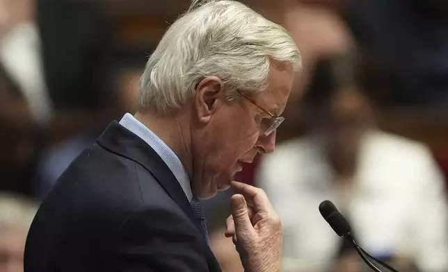 French Prime Minister Michel Barnier addresses the National Assembly prior to a vote on a no-confidence motion that could bring him down and his cabinet for the first time since 1962, Wednesday, Dec. 4, 2024 in Paris. (AP Photo/Michel Euler)