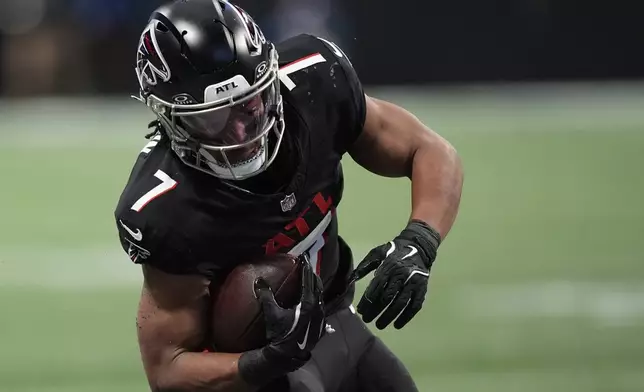 Atlanta Falcons running back Bijan Robinson runs against the Los Angeles Chargers during the first half of an NFL football game against the on Sunday, Dec. 1, 2024 in Atlanta.(AP Photo/Mike Stewart)