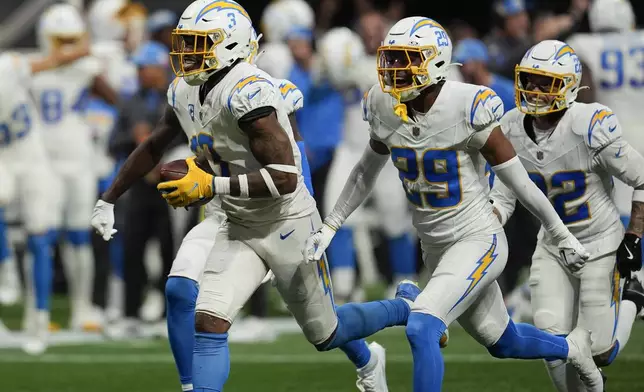 Los Angeles Chargers safety Derwin James Jr. (3) celebrates after an interception during the second half of an NFL football game against the Atlanta Falcons on Sunday, Dec. 1, 2024 in Atlanta. (AP Photo/Mike Stewart)