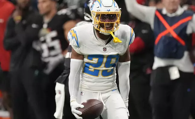 Los Angeles Chargers cornerback Tarheeb Still (29) celebrates an interception during the first half of an NFL football game against the Atlanta Falcons on Sunday, Dec. 1, 2024 in Atlanta.(AP Photo/John Bazemore)