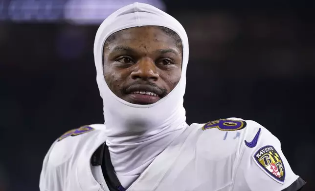 Baltimore Ravens quarterback Lamar Jackson walks off the field after an NFL football game against the Houston Texans, Wednesday, Dec. 25, 2024, in Houston. (AP Photo/Eric Christian Smith)