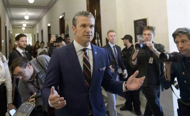 FILE - Pete Hegseth, President-elect Donald Trump's pick for secretary of defense, speaks with reporters following a meeting with senators on Capitol Hill, Nov. 21, 2024, in Washington. (AP Photo/Rod Lamkey, Jr., File)