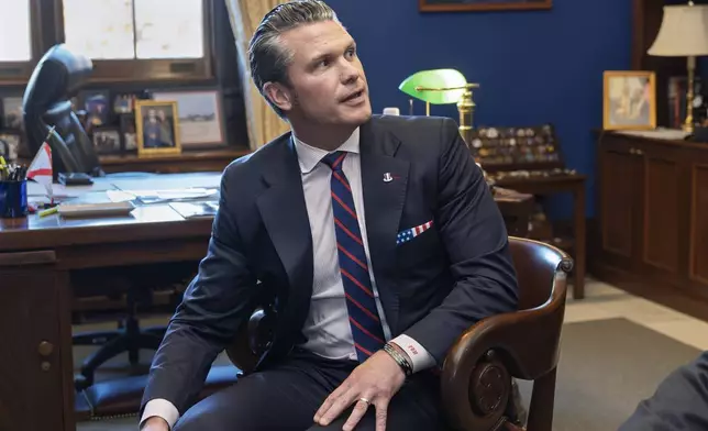 FILE - Pete Hegseth, President-elect Donald Trump's nominee to be Defense Secretary, meets with Sen. Tommy Tuberville R-Ala., a member of the Senate Armed Services Committee, at the Capitol in Washington, Dec. 2, 2024. (AP Photo/J. Scott Applewhite, File)