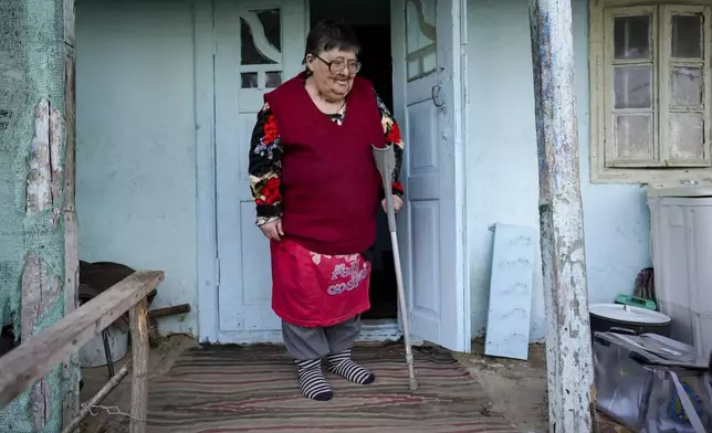 FILE - A woman looks at a mobile ballot box in the village of Ciopleni, Moldova, Sunday, Nov. 3, 2024. (AP Photo/Vadim Ghirda, File)