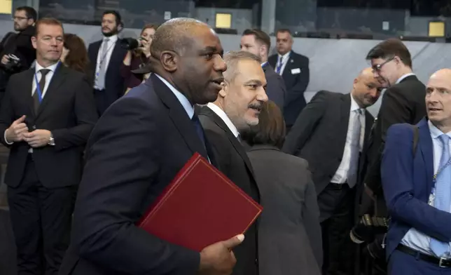 British Foreign Secretary David Lammy, left, walks with Turkey's Foreign Minister Hakan Fidan during a meeting of NATO foreign ministers at NATO headquarters in Brussels, Wednesday, Dec. 4, 2024. (AP Photo/Virginia Mayo)