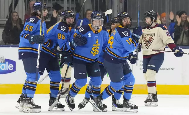 Toronto Sceptres' Jesse Compher (18) turns towards the bench to celebrate after scoring her team's opening goal against Montreal Victoire during first period of a PWHL hockey game in Toronto, Saturday, Dec. 21, 2024. (Chris Young /The Canadian Press via AP)