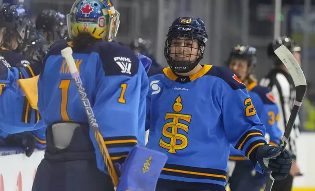 Toronto Sceptres' Sarah Nurse (20) celebrates with the bench after scoring her team's second goal against Montreal Victoire during first period of a PWHL hockey game in Toronto, Saturday, Dec. 21, 2024. (Chris Young /The Canadian Press via AP)