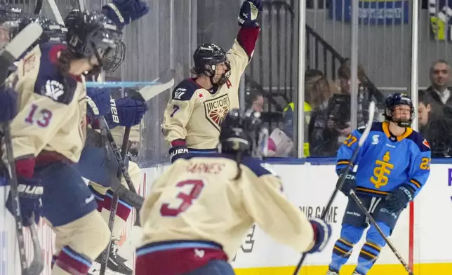 Montreal Victoire's Laura Stacey (7) celebrates after scoring the winning goal during overtime PWHL hockey game action against the Toronto Sceptres in Toronto, Saturday, Dec. 21, 2024. (Chris Young/The Canadian Press via AP)