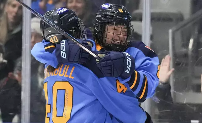 Toronto Sceptres' Izzy Daniel scores on Montreal Victoire goaltender Elaine Chuli during the third period of a PWHL hockey game in Toronto, Saturday, Dec. 21, 2024. (Chris Young/The Canadian Press via AP)