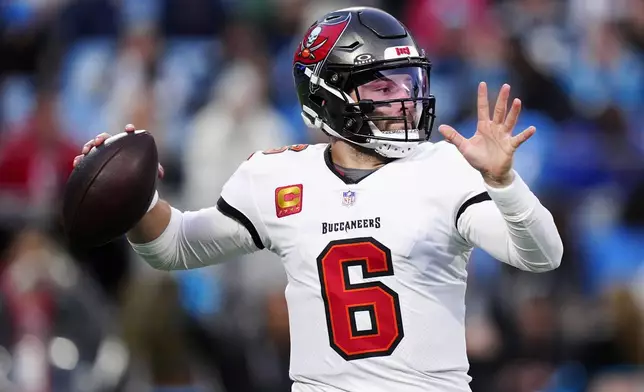 Tampa Bay Buccaneers quarterback Baker Mayfield passes against the Carolina Panthers during the first half of an NFL football game, Sunday, Dec. 1, 2024, in Charlotte, N.C. (AP Photo/Jacob Kupferman)