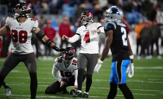 Tampa Bay Buccaneers place kicker Chase McLaughlin watches his field goal against the Carolina Panthers during the second half of an NFL football game, Sunday, Dec. 1, 2024, in Charlotte, N.C. (AP Photo/Jacob Kupferman)