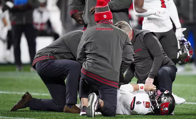 Tampa Bay Buccaneers quarterback Baker Mayfield is hurt against the Carolina Panthers during the second half of an NFL football game, Sunday, Dec. 1, 2024, in Charlotte, N.C. (AP Photo/Jacob Kupferman)