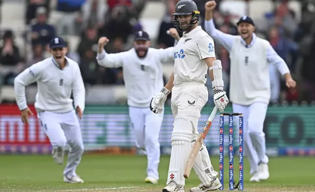 New Zealand's Kane Williamson reacts as he is dismissed during play on day three of the second cricket test between New Zealand and England at the Basin Reserve in Wellington, New Zealand, Sunday, Dec.8, 2024. (Kerry Marshall/Photosport via AP)