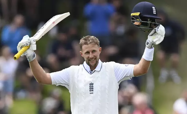 England's Joe Root reacts after scoring a century during play on day three of the second cricket test between New Zealand and England at the Basin Reserve in Wellington, New Zealand, Sunday, Dec.8, 2024. (Andrew Cornaga/Photosport via AP)