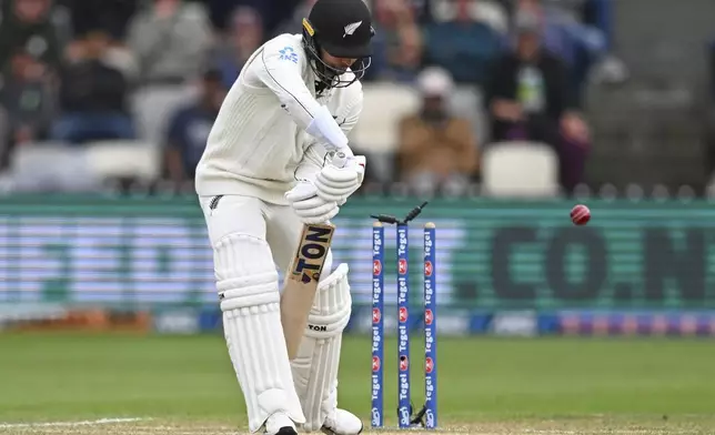 New Zealand's Devon Conway is out bowled during play on day three of the second cricket test between New Zealand and England at the Basin Reserve in Wellington, New Zealand, Sunday, Dec.8, 2024. (Kerry Marshall/Photosport via AP)