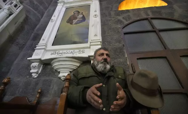 A Syrian Christians man prays during the first Sunday Mass since Syrian President Bashar Assad's ouster, at Mariamiya Orthodox Church in old Damascus, Syria, Sunday, Dec. 15, 2024. (AP Photo/Hussein Malla)