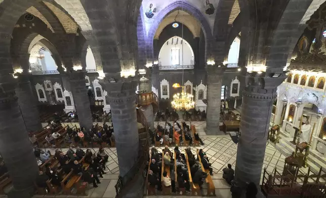 Syrian attend the first Sunday Mass since Syrian President Bashar Assad's ouster, at Mariamiya Orthodox Church in old Damascus, Syria, Sunday, Dec. 15, 2024. (AP Photo/Hussein Malla)