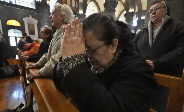 Syrian Christians attend the first Sunday Mass since Syrian President Bashar Assad's ouster, at Mariamiya Orthodox Church in old Damascus, Syria, Sunday, Dec. 15, 2024. (AP Photo/Hussein Malla)