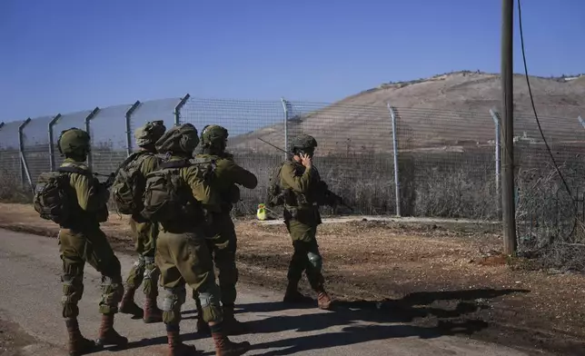 Israeli soldiers patrol the perimeter of the agricultural settlement of Avivim, next to the Lebanese border in upper Galilee, Israel, Monday Dec. 2, 2024. (AP Photo/Ohad Zwigenberg)