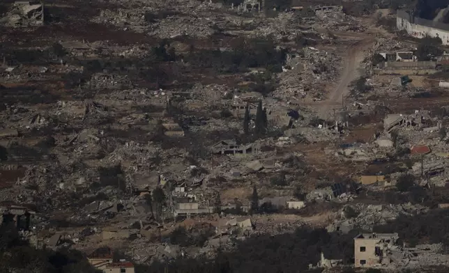 Destroyed buildings in an area of the village of Kfar Kila in southern Lebanon, located next to the Israeli-Lebanese border, as seen from northern Israel, Sunday, Dec. 1, 2024. (AP Photo/Leo Correa)