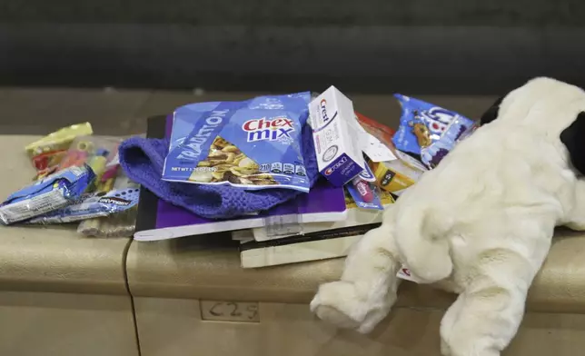 Gifts that were held in a backpacks distributed to children in Yakutat, Alaska, as part of the Alaska National Guard's Operation Santa initiative that brings Christmas to an Indigenous community that has suffered a hardship, Wednesday, Dec. 18, 2024. (AP Photo/Mark Thiessen)