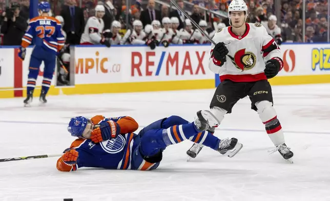 Ottawa Senators' Ridly Greig (71) looks on after high-sticking Edmonton Oilers' Leon Draisaitl (29) during second-period NHL hockey game action in Edmonton, Alberta, Sunday, Dec. 22, 2024. (Timothy Matwey/The Canadian Press via AP)