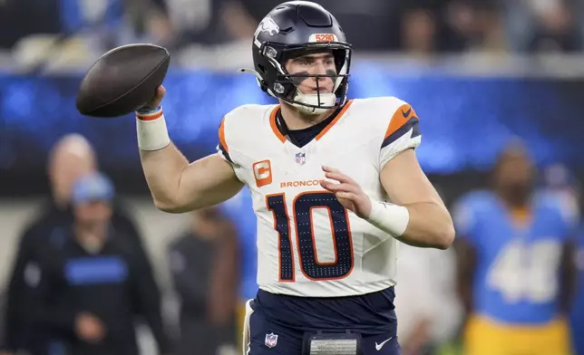 Denver Broncos quarterback Bo Nix (10) throws a pass during the first half an NFL football game against the Los Angeles Chargers, Thursday, Dec. 19, 2024, in Inglewood, Calif. (AP Photo/Eric Thayer)