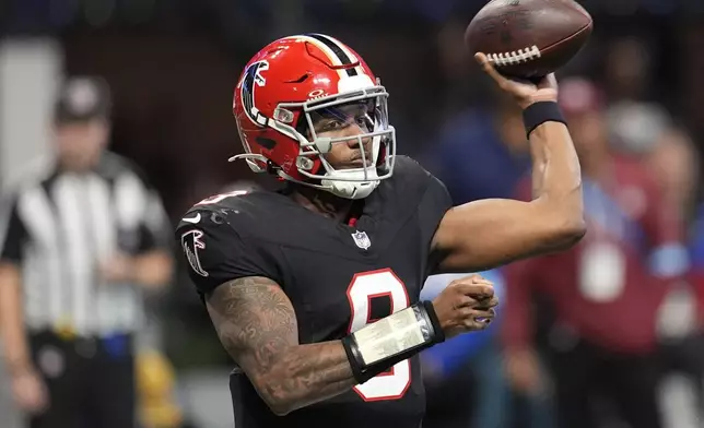 Atlanta Falcons quarterback Michael Penix Jr. (9) throws the ball in the second half of an NFL football game against the New York Giants in Atlanta, Sunday, Dec. 22, 2024. (AP Photo/Mike Stewart)