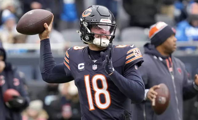 Chicago Bears quarterback Caleb Williams warms up before an NFL football game against the Detroit Lions on Sunday, Dec. 22, 2024, in Chicago. (AP Photo/Nam Y. Huh)