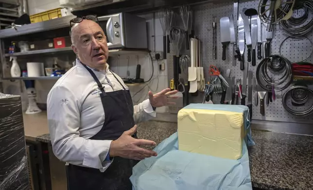 French baker Arnaud Delmontel talks about butter, its price and quality in his bakery in Paris, Monday, Dec. 16, 2024 as butter has shot up in price across Europe in recent months, adding more pain to consumers this holiday season after years of inflation in the wake of the COVID-19 pandemic and war in Ukraine.(AP Photo/Aurelien Morissard)