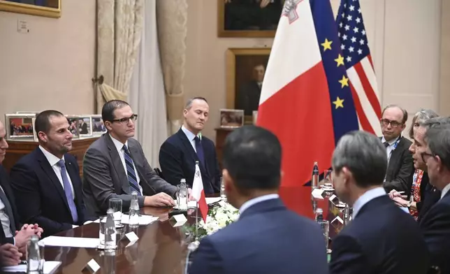 Maltese Prime Minister Robert Abela, left, listens during a meeting with U.S. Secretary of State Antony Blinken at the Auberge de Castille, in Valletta, Malta, Wednesday, Dec. 4, 2024. (AP Photo/Jonathan Borg, Pool)