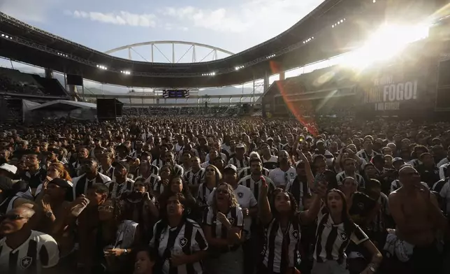 Brazil's Botafogo soccer fans react during the Copa Libertadores title match against Atletico Mineiro in Argentina, during a watch party at Nilton Santos Stadium, in Rio de Janeiro, Saturday, Nov. 30, 2024. (AP Photo/Bruna Prado)