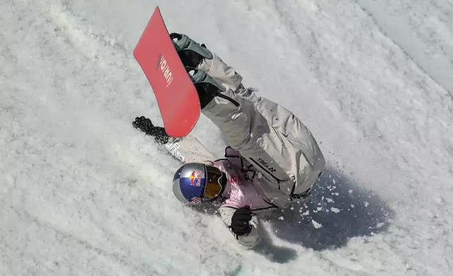 Mari Fukada of Japan falls as she competes in the women's Snowboard Big Air qualifying round during the FIS Snowboard &amp; Freeski World Cup 2024 at the Shougang Park in Beijing, Saturday, Nov. 30, 2024. (AP Photo/Andy Wong)