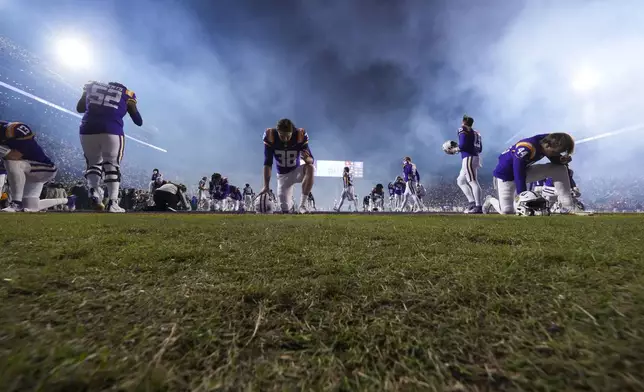 LSU punter Peyton Todd (38) kneels in prayer before an NCAA college football game against Oklahoma in Baton Rouge, La., Saturday, Nov. 30, 2024. LSU won 37-17. (AP Photo/Gerald Herbert)