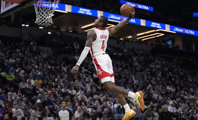 Houston Rockets guard Jalen Green goes up for a dunk during the second half of an Emirates NBA cup basketball game against the Minnesota Timberwolves, Tuesday, Nov. 26, 2024, in Minneapolis. (AP Photo/Abbie Parr)