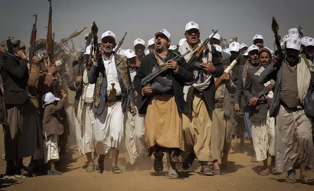 Houthi fighters march during a rally of support for the Palestinians in the Gaza Strip and against the U.S. strikes on Yemen outside Sanaa on Monday, Jan. 22, 2024. (AP Photo)