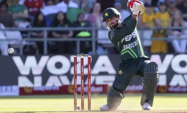 Pakistan batsman Kamran Ghulam smashes the ball towards the boundary during the second ODI International cricket match between South Africa and Pakistan in Cape Town, South Africa, Thursday, Dec. 19, 2024. (AP Photo/Halden Krog)