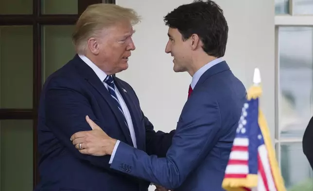 FILE - President Donald Trump greets Canadian Prime Minister Justin Trudeau upon his arrival at the White House, June 20, 2019, in Washington. (AP Photo/Alex Brandon, File)