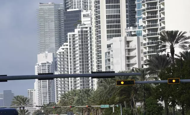 High-rise buildings are shown along Collins Avenue in Sunny Isles Beach, Fla., Tuesday, Dec. 17, 2024. (AP Photo/Lynne Sladky)